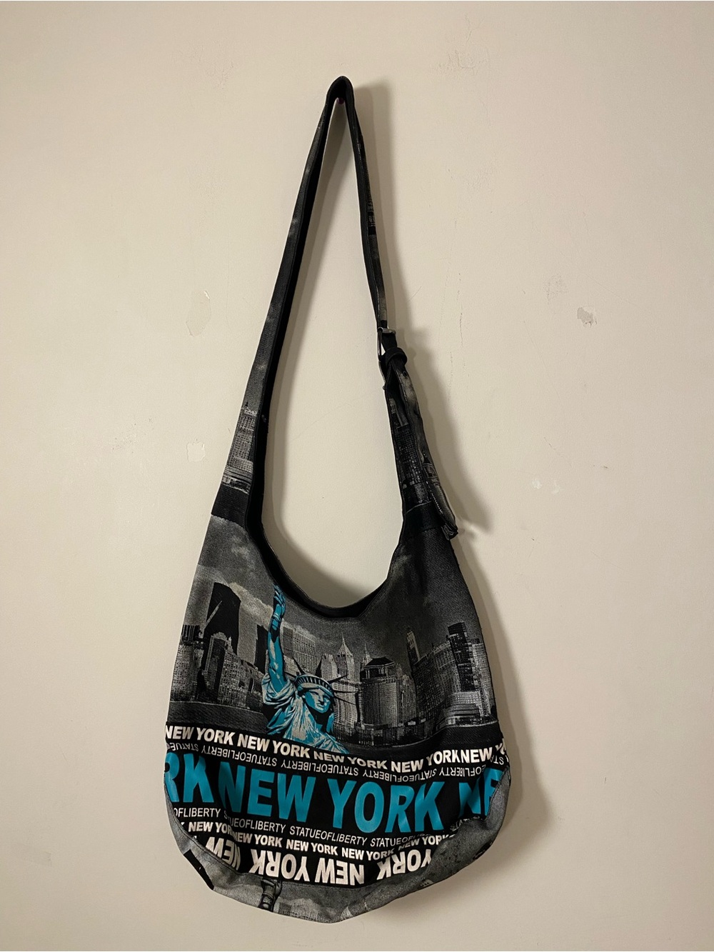 New York Graphic Sling Bag in Black and Teal